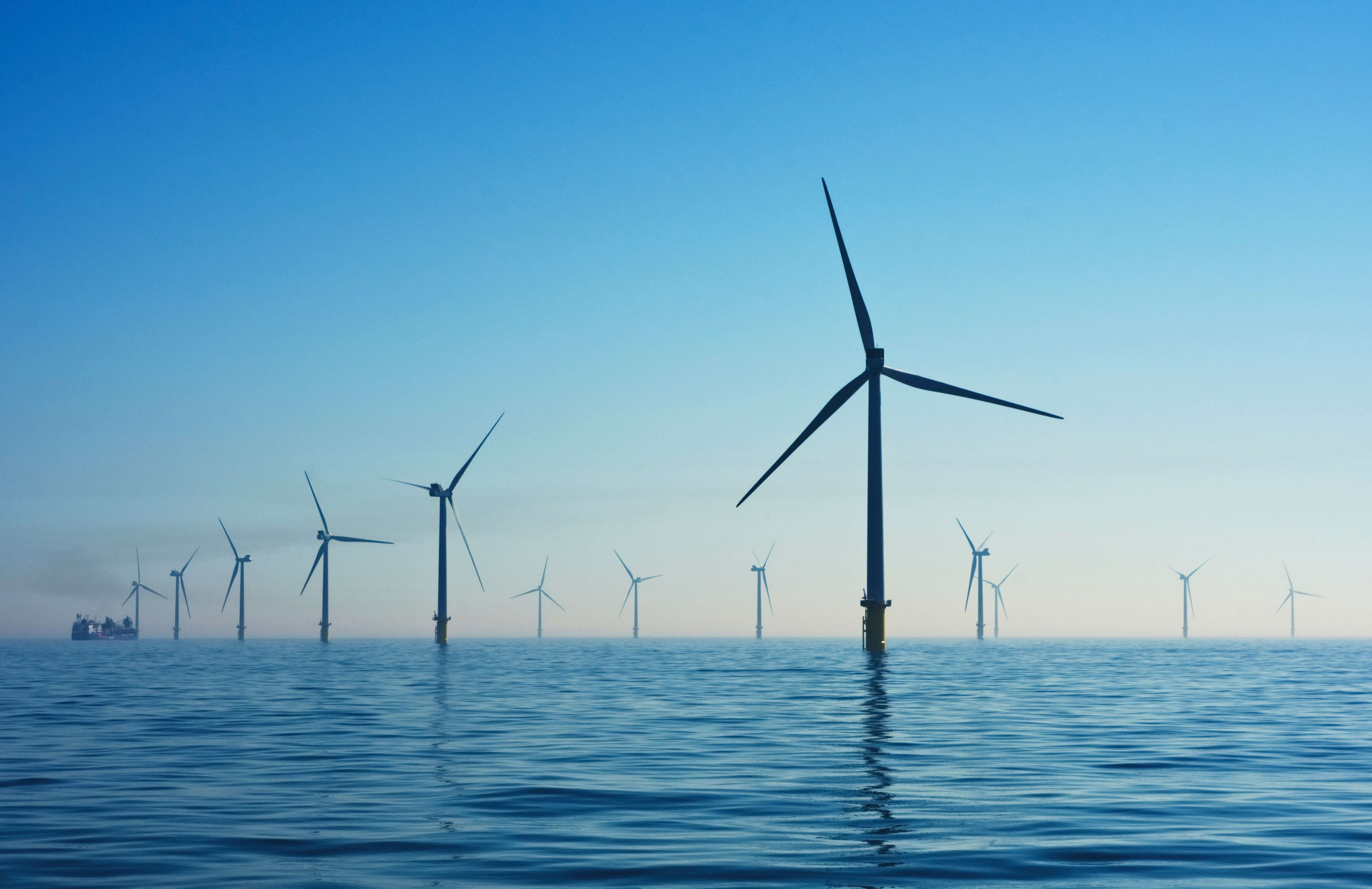 Wind turbines emerging from the ocean