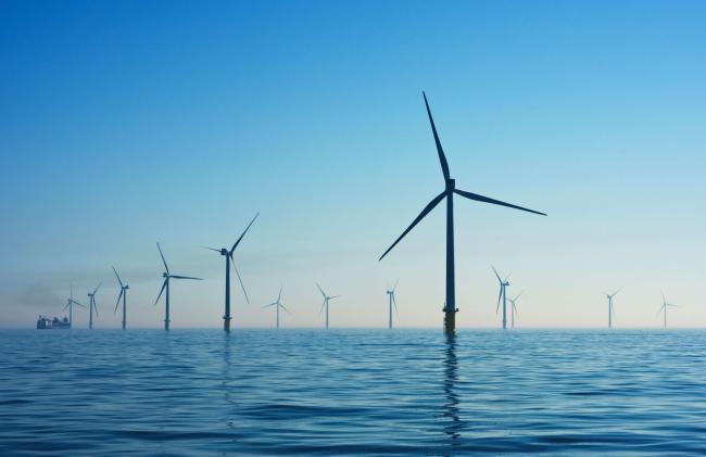 Wind turbines emerging from the ocean